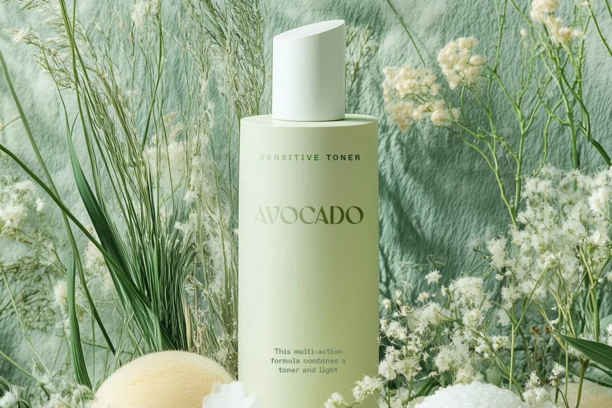 Hair care bottle among green plants