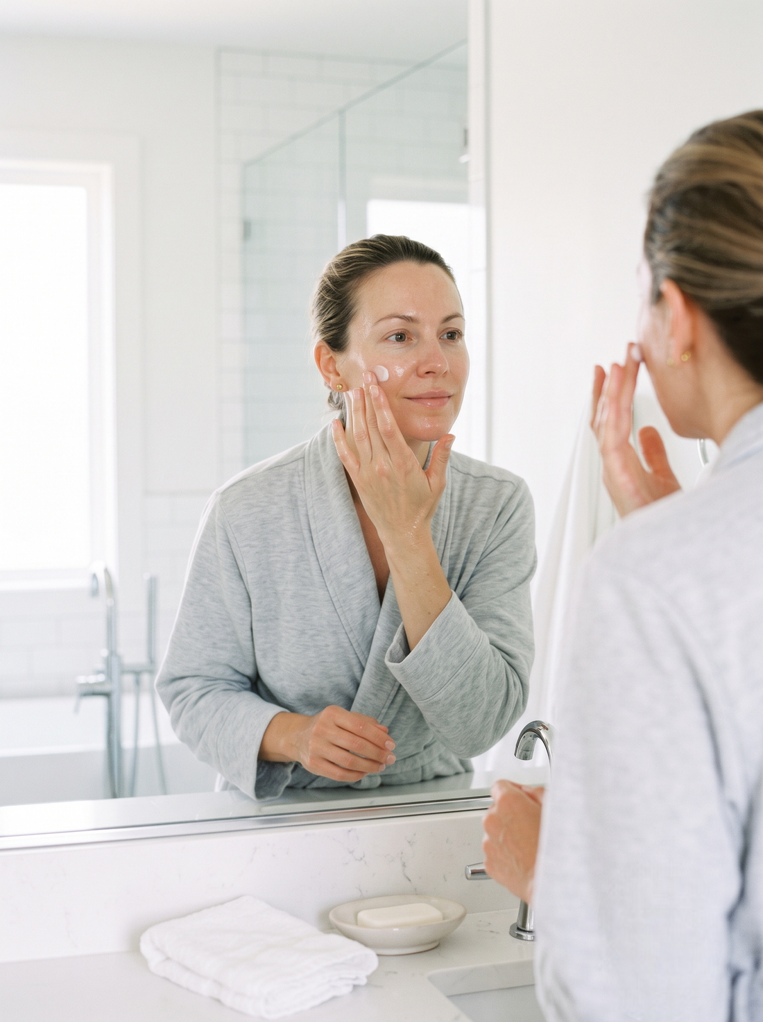 Apply a small amount of cream evenly over the cleansed face.