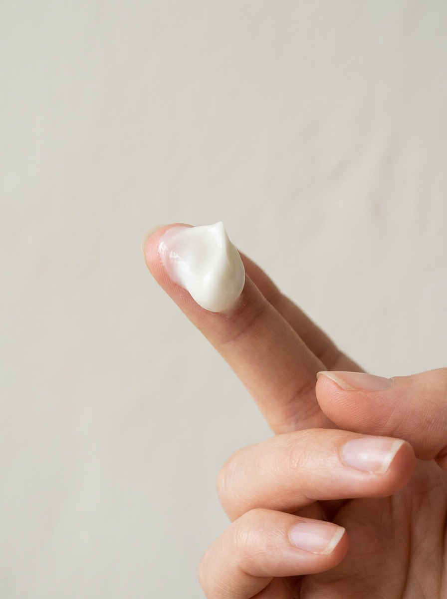 Take a generous amount of the rich Atoderm Intensive Baume onto your clean fingertips or palm
